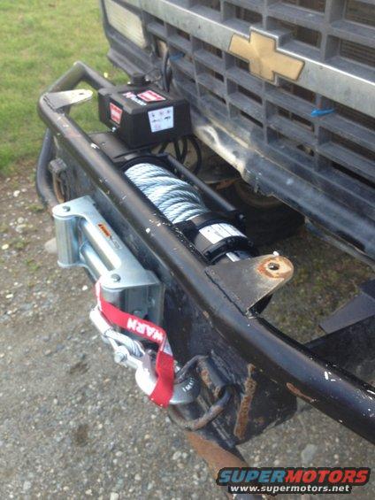 1989 Chevrolet C/K Pickup - A winch is mounted to the front bumper of a gray Chevrolet pickup truck.