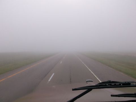 2009 Kenworth T800 - Driving on a highway through dense fog, visibility is extremely limited.