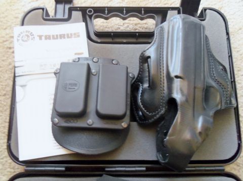 2000 Mercury Grand Marquis - Taurus pistol holster and magazine carrier set with manual, displayed in its case.