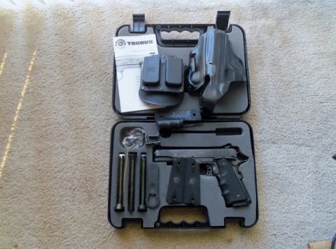 2000 Mercury Grand Marquis - Taurus pistol and accessories are neatly organized in a fitted carrying case.