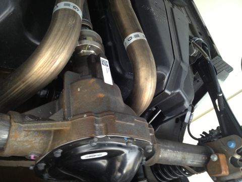 2013 Ford Mustang - Underside view of a 2013 Ford Mustang's rear differential and exhaust system.