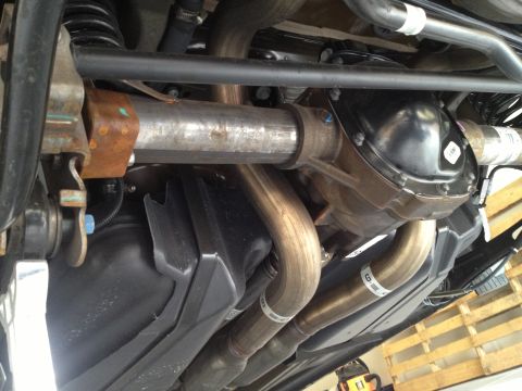 2013 Ford Mustang - Undercarriage view of a 2013 Ford Mustang, highlighting the dual exhaust system and rear differential.