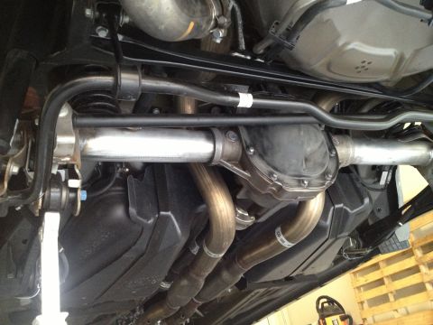 2013 Ford Mustang - Underside view shows the rear axle, differential, and dual exhaust system.