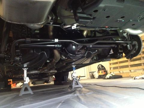 2013 Ford Mustang - Underbody view of a 2013 Ford Mustang, showing the rear axle and suspension.