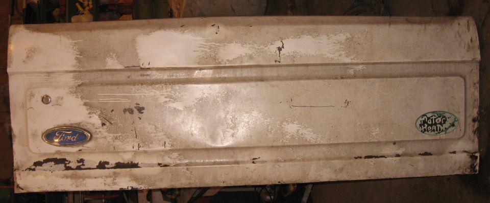 Complete tailgate front: not dent and ding.  Sticky-dirty, but can be cleaned off with solvent.