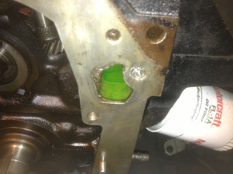 1978 Ford Bronco - A green liquid is leaking from a hole in the engine block, near an oil filter.