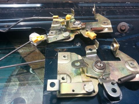 1994 Ford Bronco - Close-up view of tailgate latch mechanisms, showing internal components and wiring.