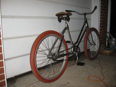 1994 Ford Bronco - This bicycle features distinctive orange tires and a classic chrome frame, seen parked outdoors.