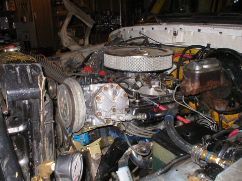 1978 Ford Bronco - Engine bay details including air filter, compressor, and radiator. Text from watermark reads SUPERMOTORS.NET.