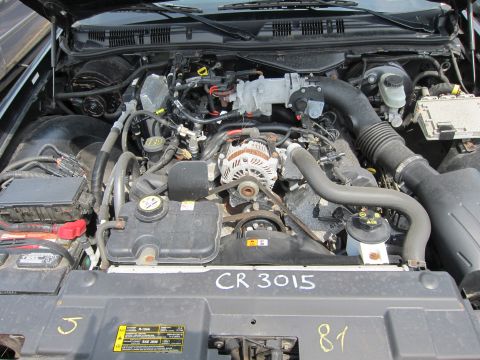 2001 Ford Crown Victoria - Engine bay of a 2001 Ford Crown Victoria, showing the V8 engine and associated components.