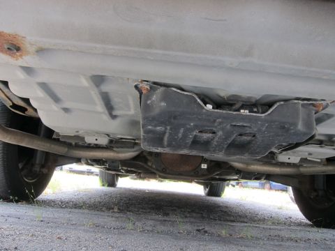 2001 Ford Crown Victoria - Underside view of a vehicle, focusing on the differential and exhaust system.