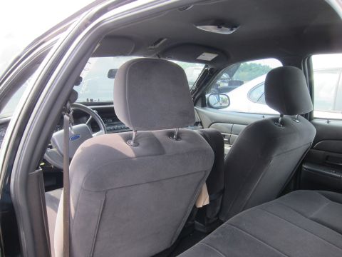 2001 Ford Crown Victoria - Interior view of a 2001 Ford Crown Victoria, focusing on the front seats and dashboard area.