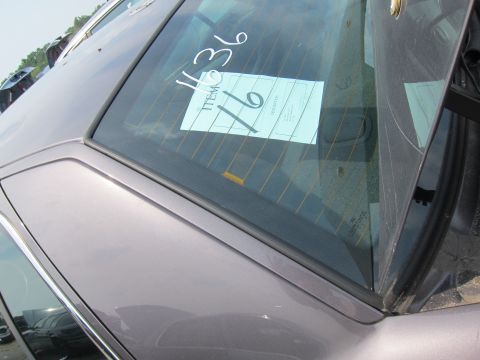2001 Ford Crown Victoria - Rear window of a 2001 Ford Crown Victoria shows a paper tag with handwritten "1136" and "Item 16".