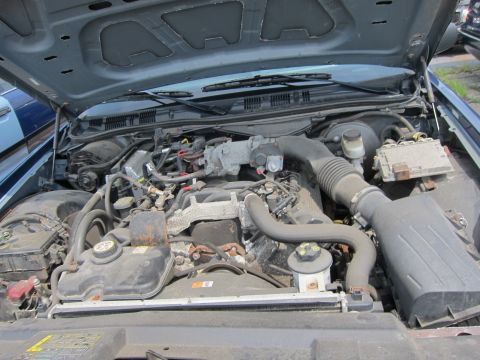 2001 Ford Crown Victoria - Engine bay of a 2001 Ford Crown Victoria, viewed from above with the hood raised.