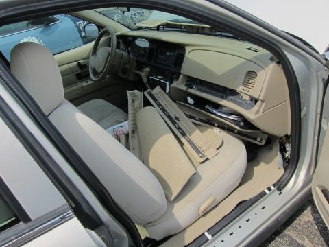 2001 Ford Crown Victoria - Interior view of a 2001 Ford Crown Victoria showing a disassembled dashboard and exposed interior components.
