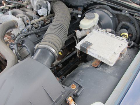 2001 Ford Crown Victoria - The engine compartment shows various components, including the air intake and the engine control unit.