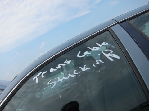 2001 Ford Crown Victoria - Writing on the car window indicates a transmission cable issue.