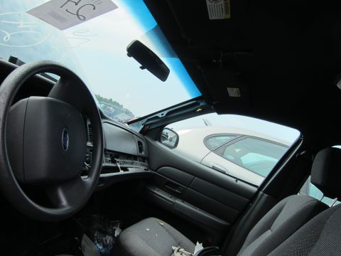 2001 Ford Crown Victoria - Interior view of a 2001 Ford Crown Victoria, with another vehicle visible outside.