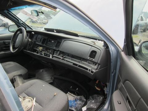 2001 Ford Crown Victoria - Interior view of a 2001 Ford Crown Victoria showing the dashboard and seats.