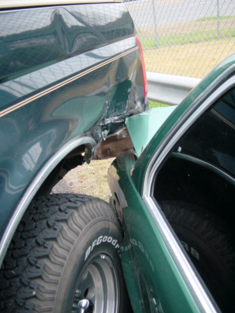 1995 Ford Bronco - This dark green 1995 Ford Bronco sustained significant rear quarter panel damage.