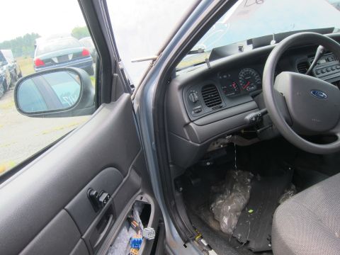 2001 Ford Crown Victoria - Interior view of a 2001 Ford Crown Victoria, with visible dashboard and door panel details.