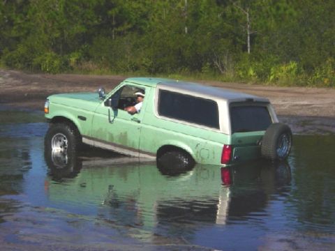 1994 Ford Bronco - 1994 Ford Bronco navigating through a water obstacle.