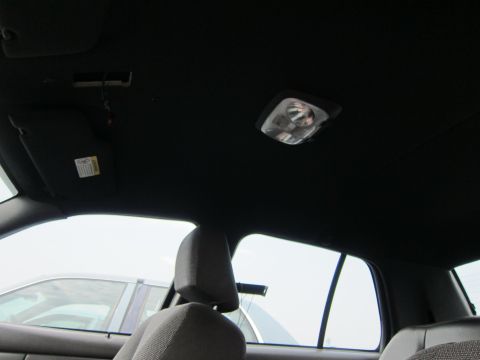 2001 Ford Crown Victoria - Interior view of a car's headliner and seating area.