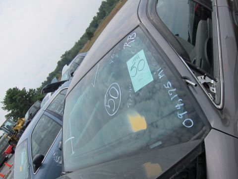 2001 Ford Crown Victoria - Windshield markings include '50', 'RB', and '0974175 mi' on a vehicle in a junkyard setting with other cars.