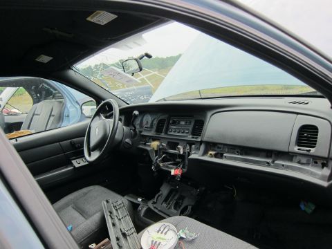 2001 Ford Crown Victoria - Interior of a 2001 Ford Crown Victoria, with another vehicle visible in the background.