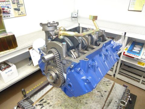 1982 Ford Bronco - Close-up of an engine block assembly, showing internal components and a blue painted exterior.