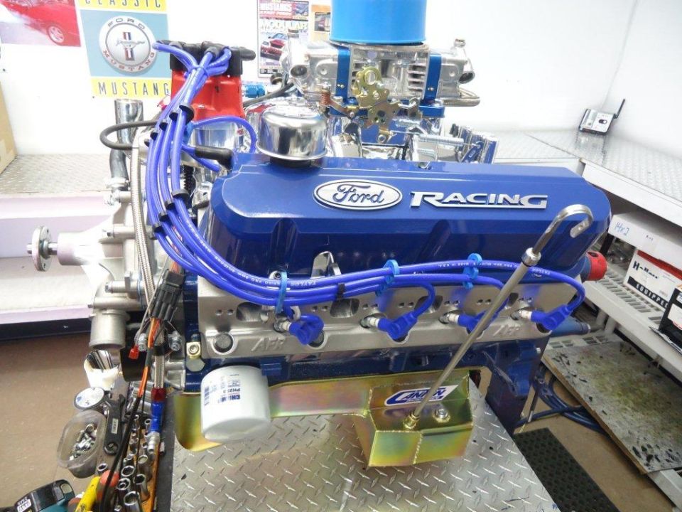 Blue Ford Racing engine with blue spark plug wires and chrome accents
