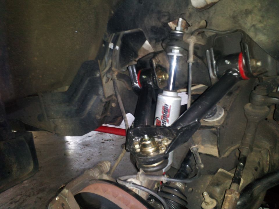 Front suspension components including shock absorber, ball joint, and control arm