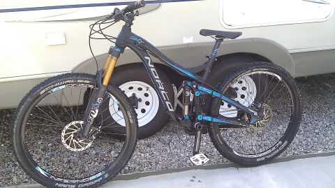 1996 Ford Bronco - Mountain bike parked in front of a trailer.