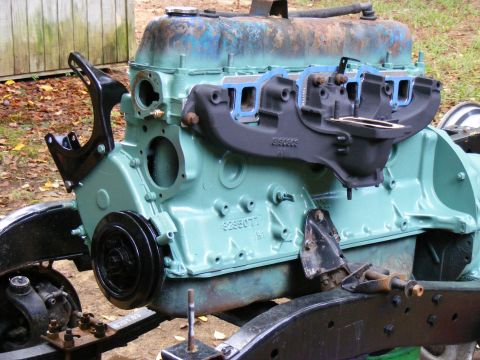 Engine block with intake manifold removed, painted teal