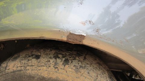 1987 Pontiac Firebird - Rust damage is visible inside the wheel well, affecting the body panel above the tire.