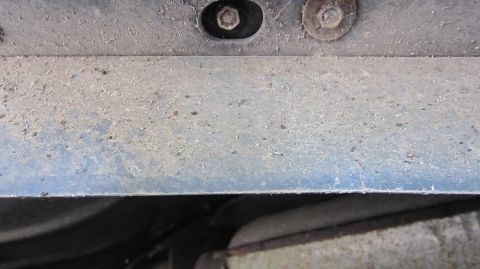 1987 Pontiac Firebird - Underside view of vehicle components, showing dust and fasteners.
