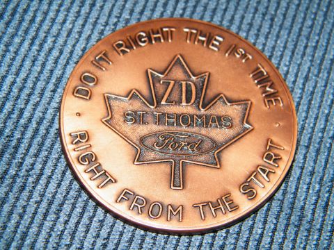 2004 Ford Crown Victoria - A copper coin the Ford logo and a maple leaf with 'ZD St. Thomas' inscribed.