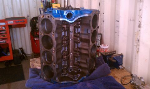 1996 Ford Bronco - Engine block on a workbench, ready for rebuild or installation.