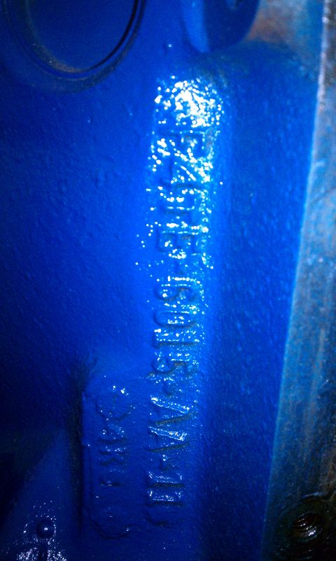 1996 Ford Bronco - Stamped numbers on a blue engine block are visible in this close-up shot.