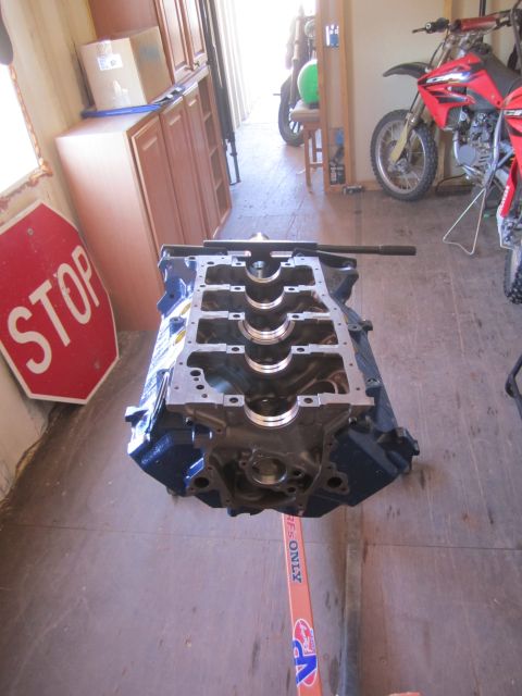 1996 Ford Bronco - Engine block on a stand with a stop sign visible in the background.