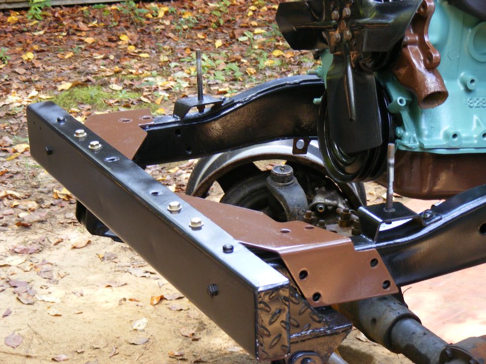 Vehicle frame with engine components, including fan and belts