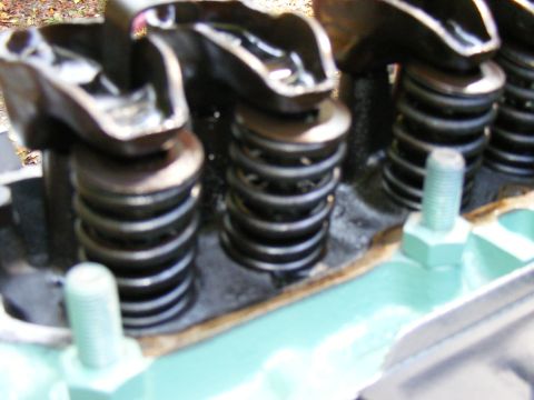 Engine valve train with springs and rockers, close-up view