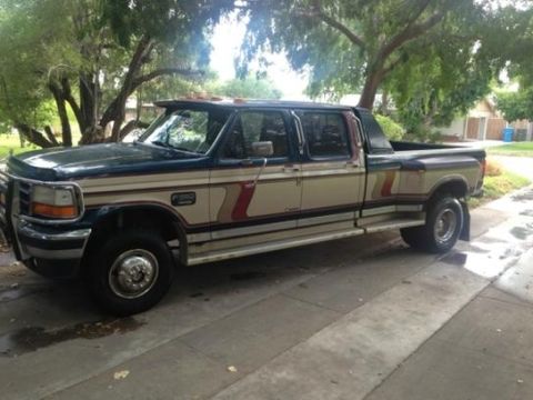 1986 Ford Bronco - This extended cab pickup truck features a dually rear axle and a custom visor above the windshield.