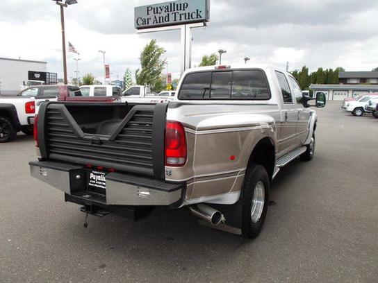 Rear view of a 2001 Ford F-350 pickup truck with a custom bed liner and chrome bumper