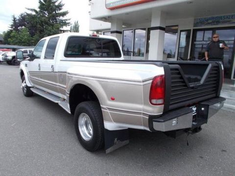 2001 Ford F-350 - This Ford F-350 Super Duty Dually pickup truck is shown from the rear quarter angle outside a dealership.