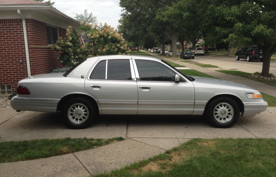 1995 Mercury Grand Marquis parked on a suburban driveway