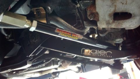 1970 Ford Torino - Close-up of aftermarket suspension components, likely for a performance vehicle, with brand labels visible.
