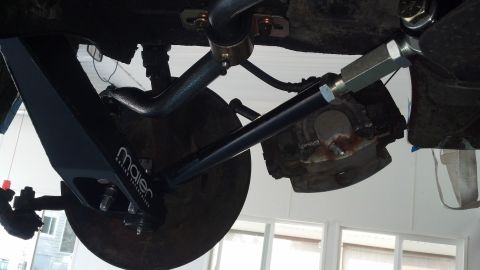 1970 Ford Torino - Aftermarket suspension part with Maier Racing branding, installed on a vehicle's undercarriage.