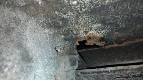 1970 Ford Torino - Undercarriage rust on a vehicle part, indicating potential structural compromise.