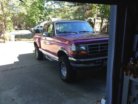 1992 Ford F-150 - This 1992 Ford F-150 pickup truck is seen from a three-quarter front view, parked in a driveway.